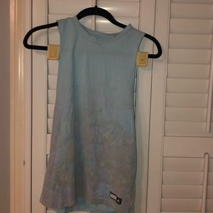 Light blue athletic tank top with floral pattern.